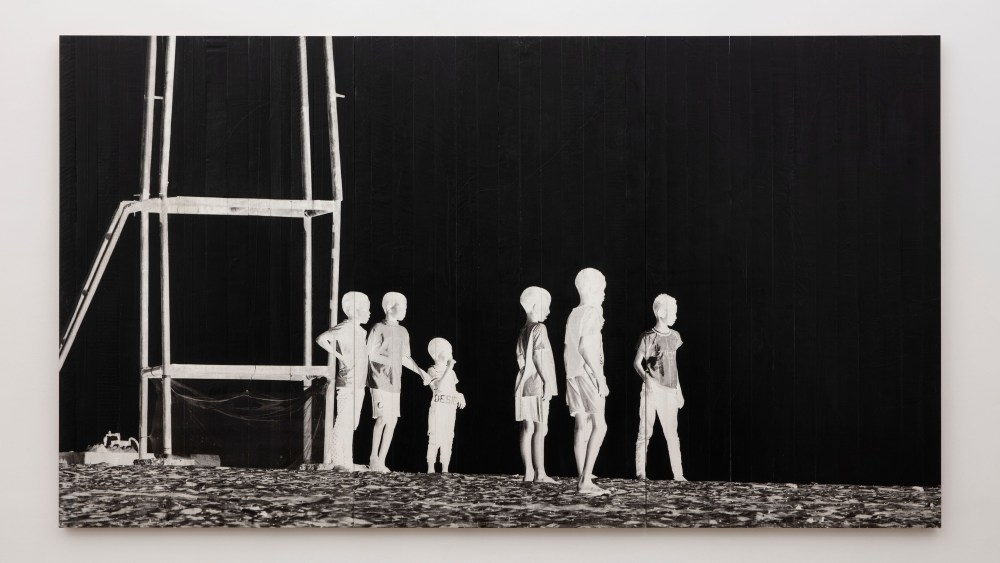 JR's "Les Enfants d'Ouranos," made with ink on wood, 2023.