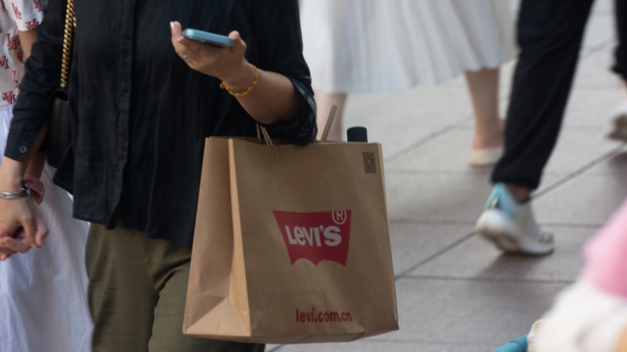 A Levi's shopping bag is being seen as people are shopping on Nanjing East Road, a popular tourist shopping spot in Shanghai, China, on August 17, 2024.
