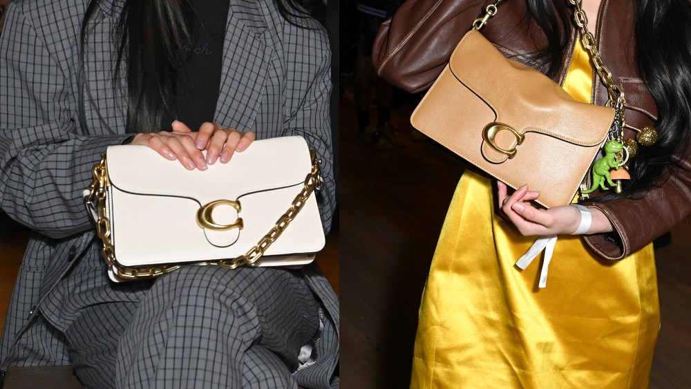 two coach chain tabby shoulder bags in the white and brown variations, help up by two different attendees of coach's fall 2025 runway show