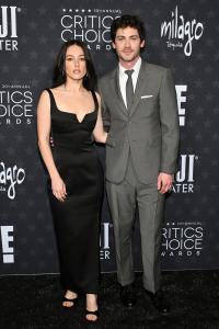 Analuisa Corrigan, Logan Lerman at the 30th Annual Critics Choice Awards held at The Barker Hangar on February 7, 2025 in Santa Monica, California.