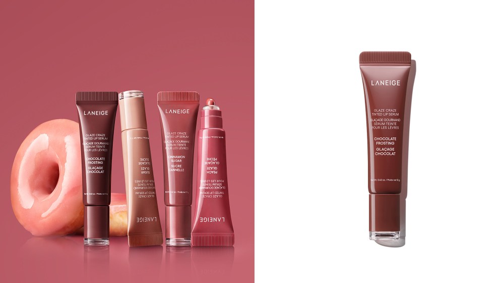 tinted lip balms standing up next to a pair of glazed donuts; lip balm in a dark purple-brown color over a white background