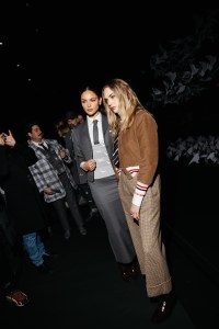 Eiza González, Cara Delevingne at the Thom Browne Fall RTW 2025 fashion show as part of New York Fashion Week held at The Shed on February 11, 2025 in New York, New York.