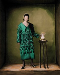 Georges Hobeika haute couture satin duchesse coat and shoes (worn throughout). Chopard Haute Joaillerie collection necklaces, one featuring diamonds and an emerald set in 18-karat white gold and the second featuring diamonds set in 18-karat white gold.