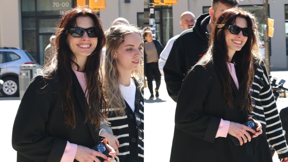 Anne Hathaway is seen on the set of "Verity" on March 10 in New York, pink sweatsuit, Serena Williams x Off-White Nike, street style