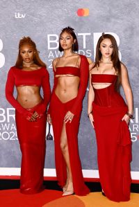 LONDON, ENGLAND - MARCH 01: (EDITORIAL USE ONLY) Renée Downer, Jorja Douglas and Stella Quaresma of Flo attend The BRIT Awards 2025 at the InterContinental London - The O2 on March 01, 2025 in London, England. (Photo by Gareth Cattermole/Getty Images)