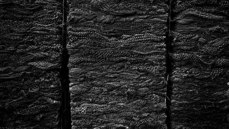 Made from recycled fishing nets, NetPlus recycled nylon yarn can be woven into a variety of performance fabrics, such as Outerknown's boardshorts.
