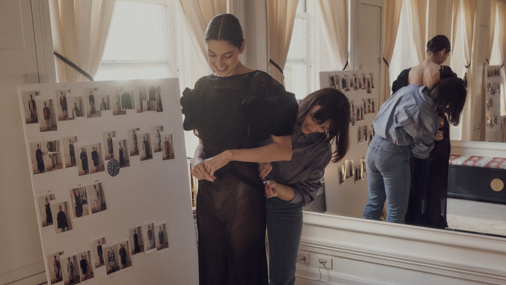 Patricia Voto fitting a model in a '30s velvet dress at the One/Of atelier.