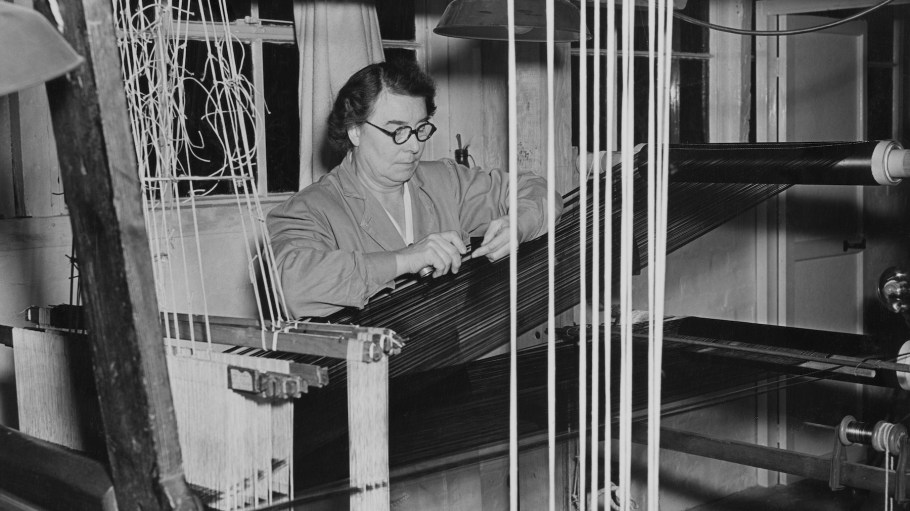 Weaver Lily Lee at her loom in 1952 weaving velvet for the Queen Mother's Coronation robe, ahead of the Coronation of Elizabeth II, in England.