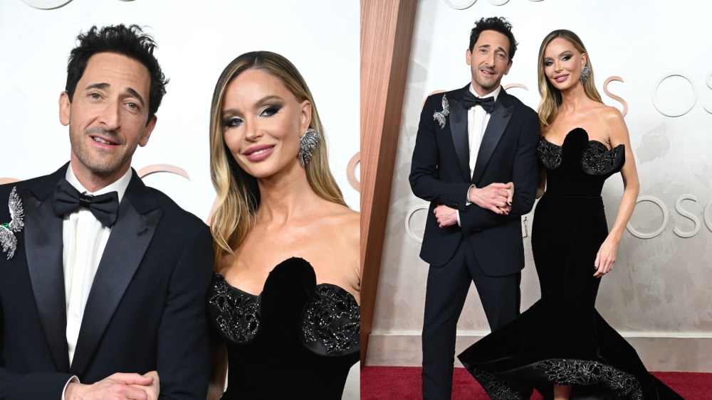 Adrien Brody and Georgina Chapman wearing marchesa dress on the Oscars 2025 red carpet.
