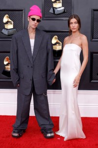 LAS VEGAS, NEVADA - APRIL 03: (L-R) Justin Bieber and Hailey Bieber attend the 64th Annual GRAMMY Awards at MGM Grand Garden Arena on April 03, 2022 in Las Vegas, Nevada. (Photo by Frazer Harrison/Getty Images for The Recording Academy)