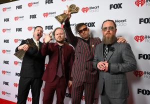 Brent Smith, Zach Myers, Eric Bass, Barry Kerch of Shinedown at the 2025 iHeartRadio Music Awards held at the Dolby Theatre on March 17, 2025 in Los Angeles, California.