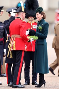 LONDON, ENGLAND - MARCH 17: Catherine, Princess of Wales presents traditional sprigs of shamrock to a member of the Irish Guards¬†during the 2025 Irish Guards' St. Patrick's Day Parade at Wellington Barracks on March 17, 2025 in London, England. Catherine, Princess of Wales attends the parade as Colonel of the Regiment. (Photo by Chris Jackson/Getty Images)