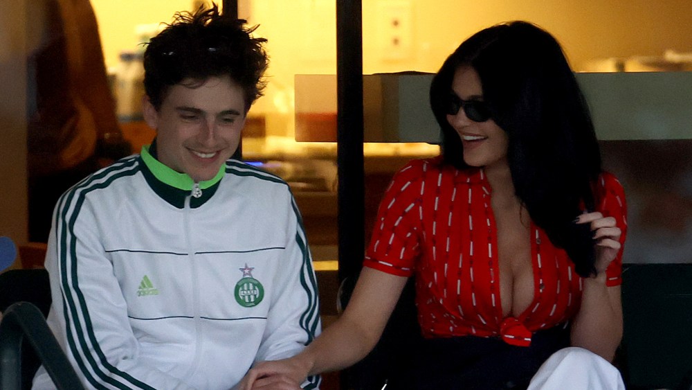 Timothée Chalamet and Kylie Jenner attend a match during the BNP Paribas Open on March 9 in Indian Wells, Calif, red celine tie-front top, celine sunglasses, tennis tournament