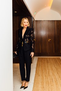 A look at Leslie Bibb getting ready for the Balmain Fall 2025 show in Paris.