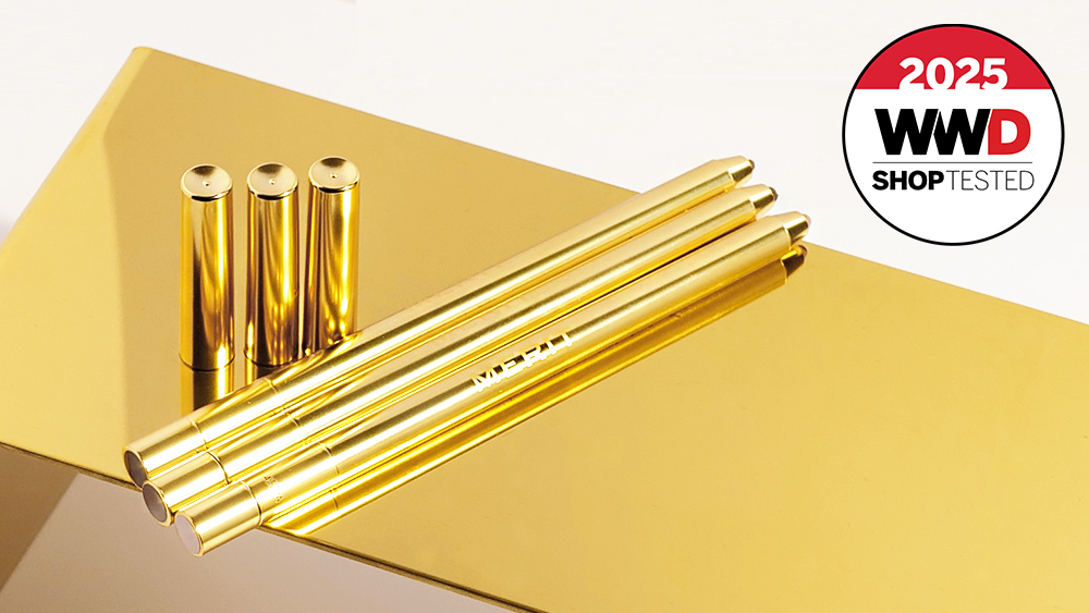 Merit Beauty lip liners on a gold surface