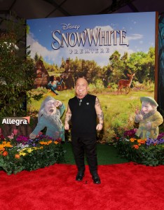 LOS ANGELES, CALIFORNIA - MARCH 15: Martin Klebba joins Sneezy & Sleepy at the Allegra activation on the red carpet for Disney's "Snow White" premiere at El Capitan Theatre on March 15, 2025 in Hollywood, California. The Allegra activation asks what Sneezy and Sleepy would be like if they weren't sneezy or sleepy. (Photo by Phillip Faraone/Getty Images for Allegra)