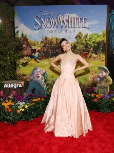 LOS ANGELES, CALIFORNIA - MARCH 15: Rachel Zegler joins Sneezy & Sleepy at the Allegra activation on the red carpet for Disney's "Snow White" premiere at El Capitan Theatre on March 15, 2025 in Hollywood, California. The Allegra activation asks what Sneezy and Sleepy would be like if they weren't sneezy or sleepy. (Photo by Phillip Faraone/Getty Images for Allegra)