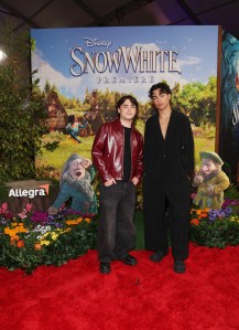 LOS ANGELES, CALIFORNIA - MARCH 15: (L-R) Joshua Colley and Malachi Barton joins Sneezy & Sleepy at the Allegra activation on the red carpet for Disney's "Snow White" premiere at El Capitan Theatre on March 15, 2025 in Hollywood, California. The Allegra activation asks what Sneezy and Sleepy would be like if they weren't sneezy or sleepy. (Photo by Phillip Faraone/Getty Images for Allegra)