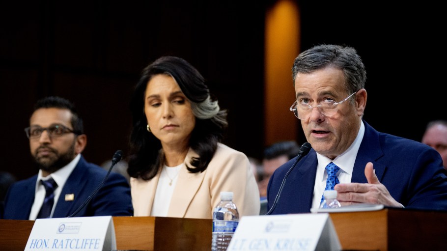 CIA Director John Ratcliffe (R), accompanied by FBI Director Kash Patel (L), and Director of National Intelligence Tulsi Gabbard (C), speaks during a Senate Committee on Intelligence Hearing on March 25, 2025 in Washington, DC.