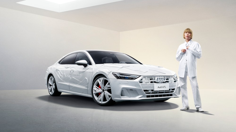 Designer Feng Chen Wang with a custom Audi A7 designed by her