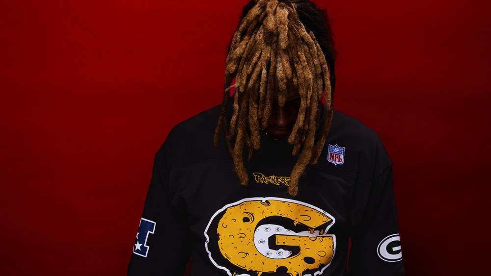 Lil Wayne in a jersey from his new NFL Mitchell & Ness collection.