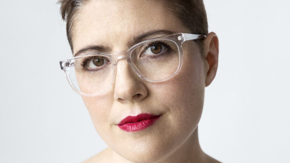 Christine Hunsicker wearing glasses and white top.