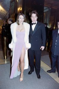 Elizabeth Hurley and Hugh Grant attend the opening gala for an exhibit honoring late Italian designer Gianni Versace at the Metropolitan Museum of Art in New York City on December 8, 1997.