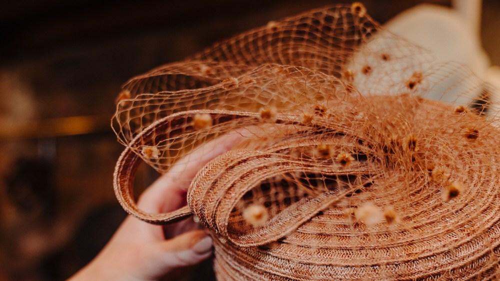 One of the women's hats that is part of the Gigi Burris x Woodford Reserve Capsule Collection.