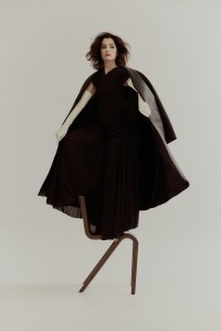 Dior Men blended silk scuba canvas coat over Proenza Schouler pleated jersey dress. Carolina Amato gloves.