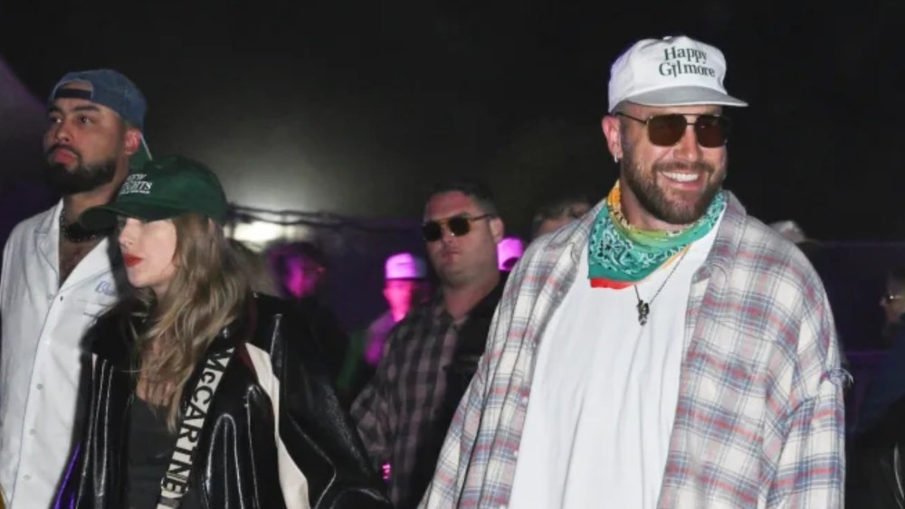 Taylor Swift and Travis Kelce at Neon Carnival held during the Coachella Music and Arts Festival on April 13, 2024 in Thermal, California. (Photo by Gilbert Flores/WWD via Getty Images)