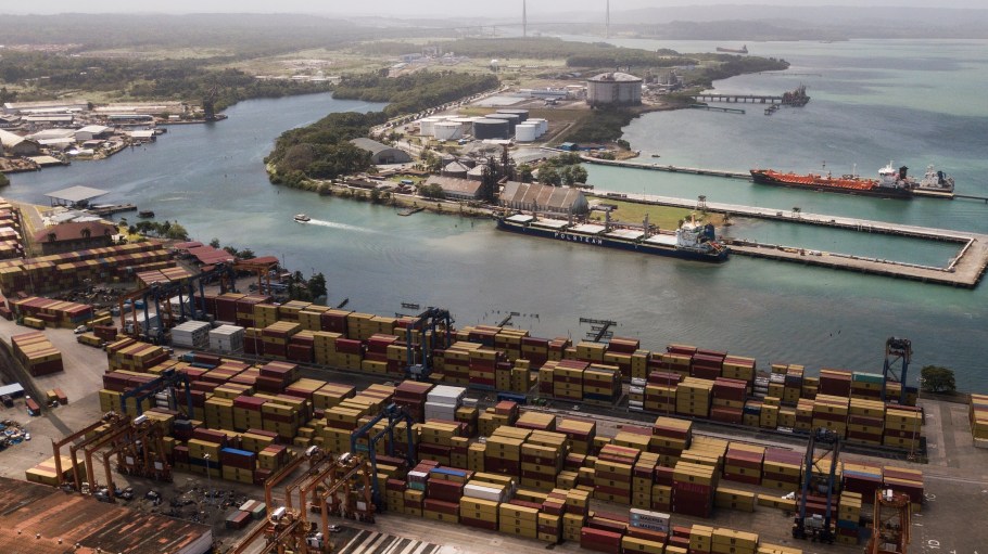 Cargo containers sit stacked as cranes load and unload containers from cargo ships at the Cristobal port, operated by the Panama Ports Company, in Colon, Panama, Feb. 4, 2025.