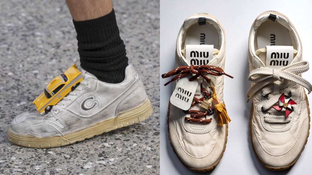 model displaying a coach shoe with an oversized taxi cab charm on it; miu miu sneakers with different colors of laces and lace charms