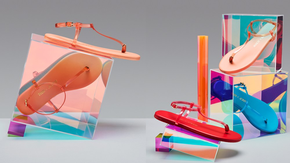 sandal resting on a glass-like block; three sandals in various colors either resting on or inside clear blocks
