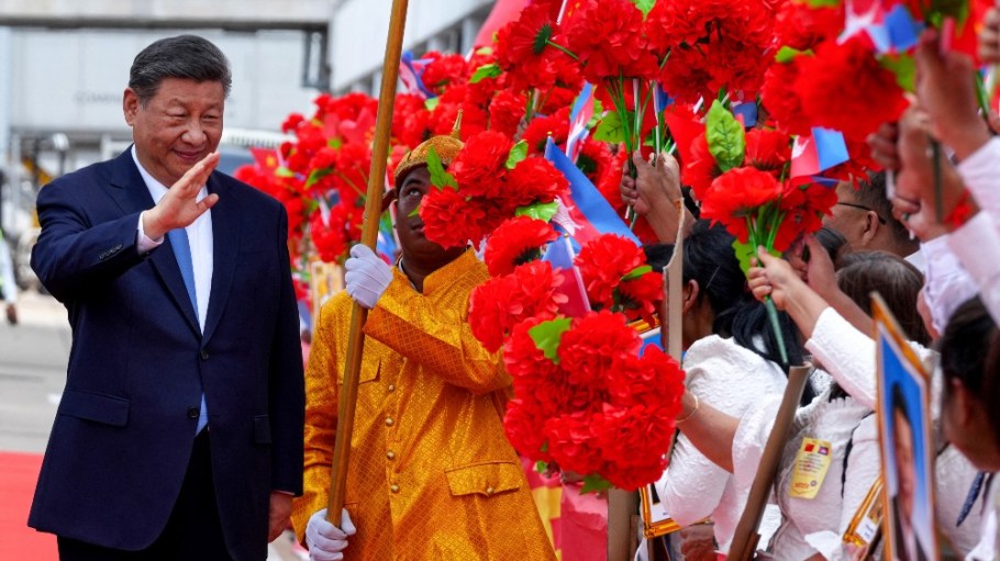 China's President Xi Jinping greeting people upon arrival at Phnom Penh International Airport in Cambodia.
