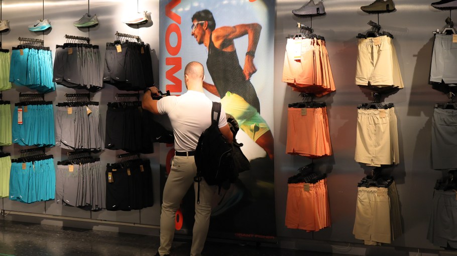 NEW YORK, NEW YORK - APRIL 03: People shop at a Nike store on Fifth Avenue on April 03, 2025 in New York City. U.S. President Donald Trump declared a U.S. economic emergency and announced sweeping tariffs of at least 10%, with rates even higher for 60 countries or those that have a high trade deficit with the U.S. The tariffs will affect electronics, automobiles, clothing and shoes, wines and spirits, and Swiss watches.   (Photo by Michael M. Santiago/Getty Images)