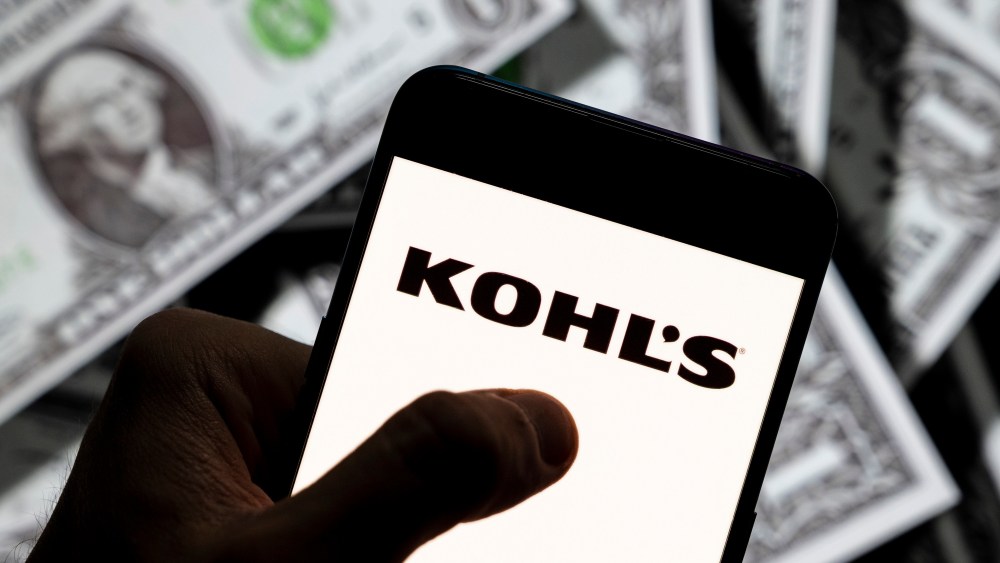 In this photo illustration the American department store retailing chain company Kohl's logo seen displayed on a smartphone with USD (United States dollar) currency in the background.