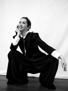 Willy Chavarria faille pants and blazer. Celine by Hedi Slimane silk crepe and acetate shirt. Necklace in yellow gold and diamonds, three rings in yellow gold and diamonds, 2 rings in  white gold and diamonds and yellow gold and diamond earrings. All Louis Vuitton Le Damier de Louis Vuitton collection.