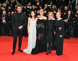 Michael Epp, Esmé Creed-Miles, Imogen Poots, Kim Gordon, Thora Birch at the "Bono: Stories of Surrender" Premiere at The 78th Cannes Film Festival at Palais des Festivals on May 16, 2025 in Cannes, France.