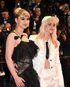 Imogen Poots, Kristen Stewart at the "Bono: Stories of Surrender" Premiere at The 78th Cannes Film Festival at Palais des Festivals on May 16, 2025 in Cannes, France.