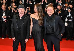 The Edge, Amal Clooney, Bono at the "Bono: Stories of Surrender" Premiere at The 78th Cannes Film Festival at Palais des Festivals on May 16, 2025 in Cannes, France.