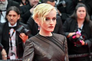 Julia Garner at the Opening Ceremony and "Leave One Day" Premiere at the 78th Cannes Film Festival held at Palais des Festivals on May 13, 2025 in Cannes, France.