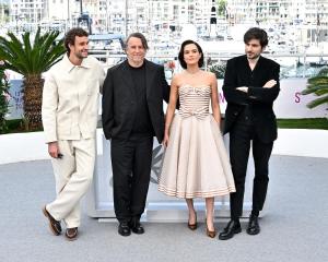 Aubry Dullin, Richard Linklater, Zoey Deutch, Guillaume Marbeck at the "New Wave" Photocall during the 78th Cannes Film Festival held at Palais des Festivals on May 18, 2025 in Cannes, France.