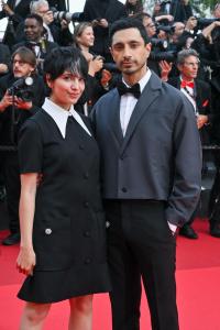 Fatima Farheen Mirza, Riz Ahmed at "The Phoenician Scheme" Premiere during the 78th Cannes Film Festival at Palais des Festivals on May 18, 2025 in Cannes, France.