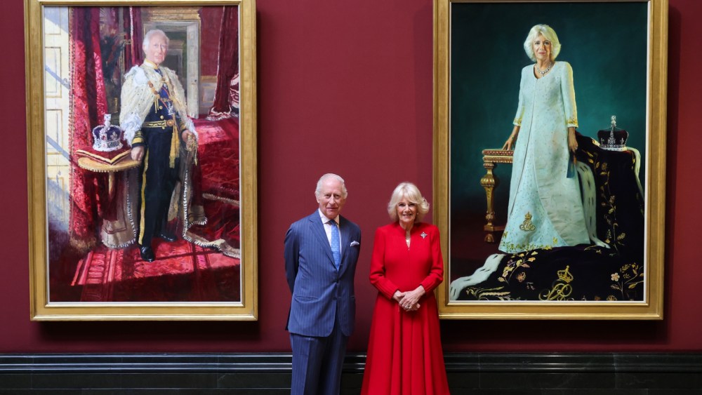 LONDON, ENGLAND - MAY 06: King Charles III and Queen Camilla pose with their official Coronation State Portraits during a visit to The National Gallery on May 06, 2025 in London, England. To mark the second anniversary of their Coronation, The King and Queen will unveil their official Coronation State Portraits by Peter Kuhfeld and Paul S. Benney, now part of The Royal Collection. The portraits will be revealed in the Central Hall, followed by the reopening of the refurbished Sainsbury Wing. Their Majesties will then tour the space and meet participants in the gallery's outreach education programme. (Photo by Chris Jackson/Getty Images)