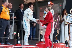 MONTE-CARLO, MONACO - MAY 25: Second placed Charles Leclerc of Monaco and Scuderia Ferrari receives his trophy from Charlene, Princess of Monaco on the podium during the F1 Grand Prix of Monaco at Circuit de Monaco on May 25, 2025 in Monte-Carlo, Monaco. (Photo by Steven Tee/Getty Images)