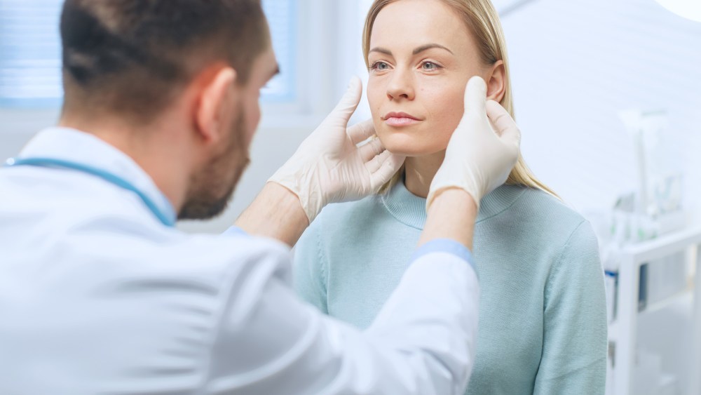 Plastic / Cosmetic Surgeon Examines Beautiful Woman's Face, Touches it with Gloved Hands, Inspecting Healed Face after Plastic Surgery with Amazing Results.