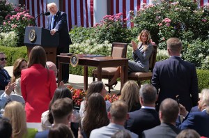 WASHINGTON, DC - MAY 19: U.S. President Donald Trump and first lady Melania Trump acknowledge Francesca Mani and Brandon Guffey during the signing ceremony for the TAKE IT DOWN Act in the Rose Garden of the White House on May 19, 2025 in Washington, DC. The first lady made the Tools to Address Known Exploitation by Immobilizing Technological Deepfakes on Websites and Networks (TAKE IT DOWN) Act a priority, traveling to Capitol Hill to lobby lawmakers and show her support for the legislation, which addresses non-consensual intimate imagery, or "revenge porn," and artificial intelligence deepfakes posted online and to social media. (Photo by Chip Somodevilla/Getty Images)