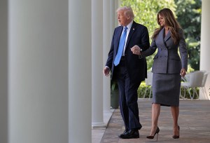 WASHINGTON, DC - MAY 19: U.S. President Donald Trump and first lady Melania Trump arrive at the signing ceremony for the TAKE IT DOWN Act in the Rose Garden of the White House on May 19, 2025 in Washington, DC. The first lady made the Tools to Address Known Exploitation by Immobilizing Technological Deepfakes on Websites and Networks (TAKE IT DOWN) Act a priority, traveling to Capitol Hill to lobby lawmakers and show her support for the legislation, which addresses non-consensual intimate imagery, or "revenge porn," and artificial intelligence deepfakes posted online and to social media. (Photo by Chip Somodevilla/Getty Images)