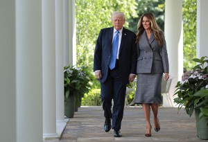 WASHINGTON, DC - MAY 19: U.S. President Donald Trump and first lady Melania Trump arrive at the signing ceremony for the TAKE IT DOWN Act in the Rose Garden of the White House on May 19, 2025 in Washington, DC. The first lady made the Tools to Address Known Exploitation by Immobilizing Technological Deepfakes on Websites and Networks (TAKE IT DOWN) Act a priority, traveling to Capitol Hill to lobby lawmakers and show her support for the legislation, which addresses non-consensual intimate imagery, or "revenge porn," and artificial intelligence deepfakes posted online and to social media. (Photo by Chip Somodevilla/Getty Images)