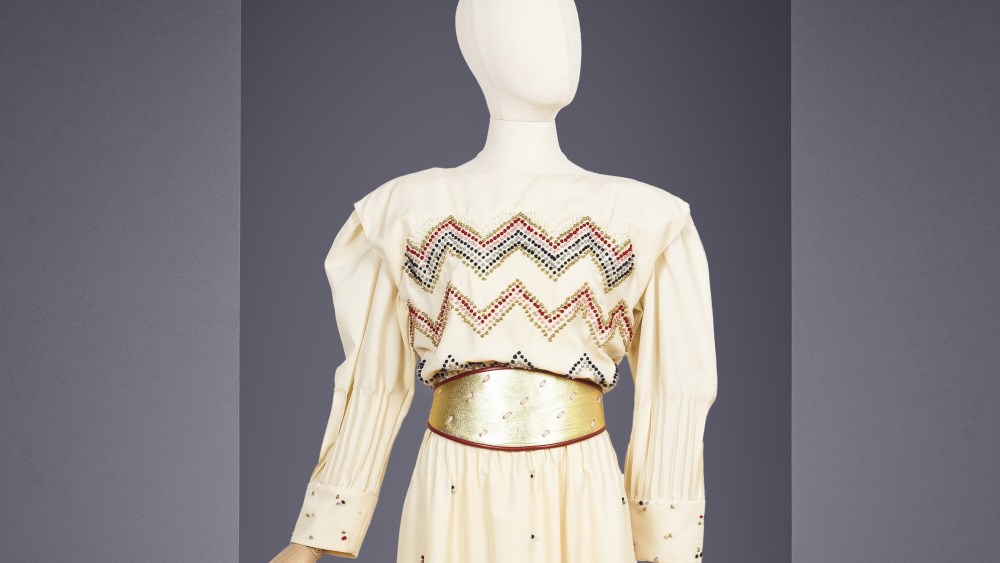 An ivory silk evening dress with embroidered detailing and gold belt by Karl Lagerfeld for Chloé, circa 1980, being auctioned at Bonhams Cornette de Saint Cyr.